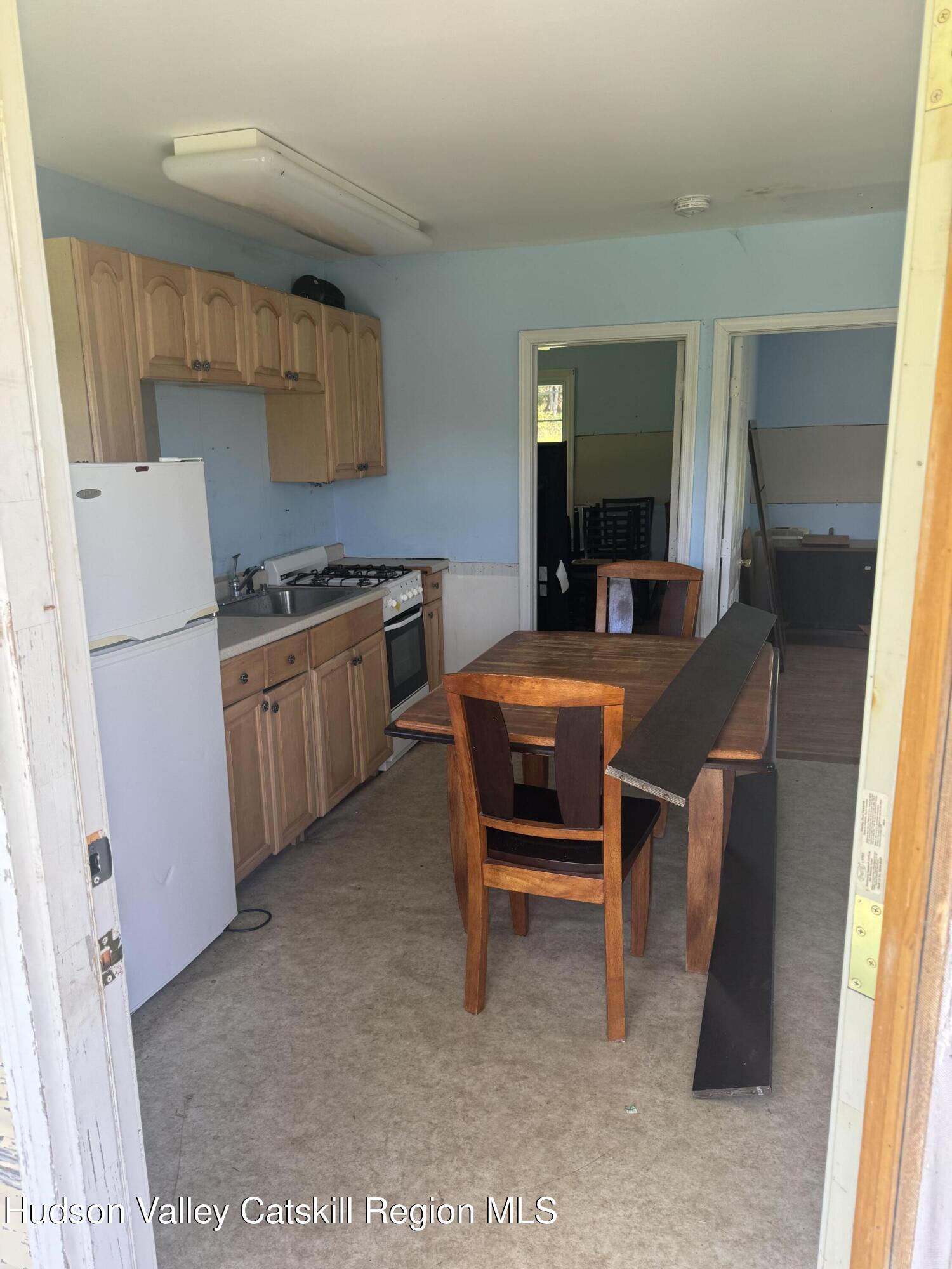 66-84 Katzman Road Ellenville, NY 12428 - Photo 25 of 30 a room with furniture a washer and dryer