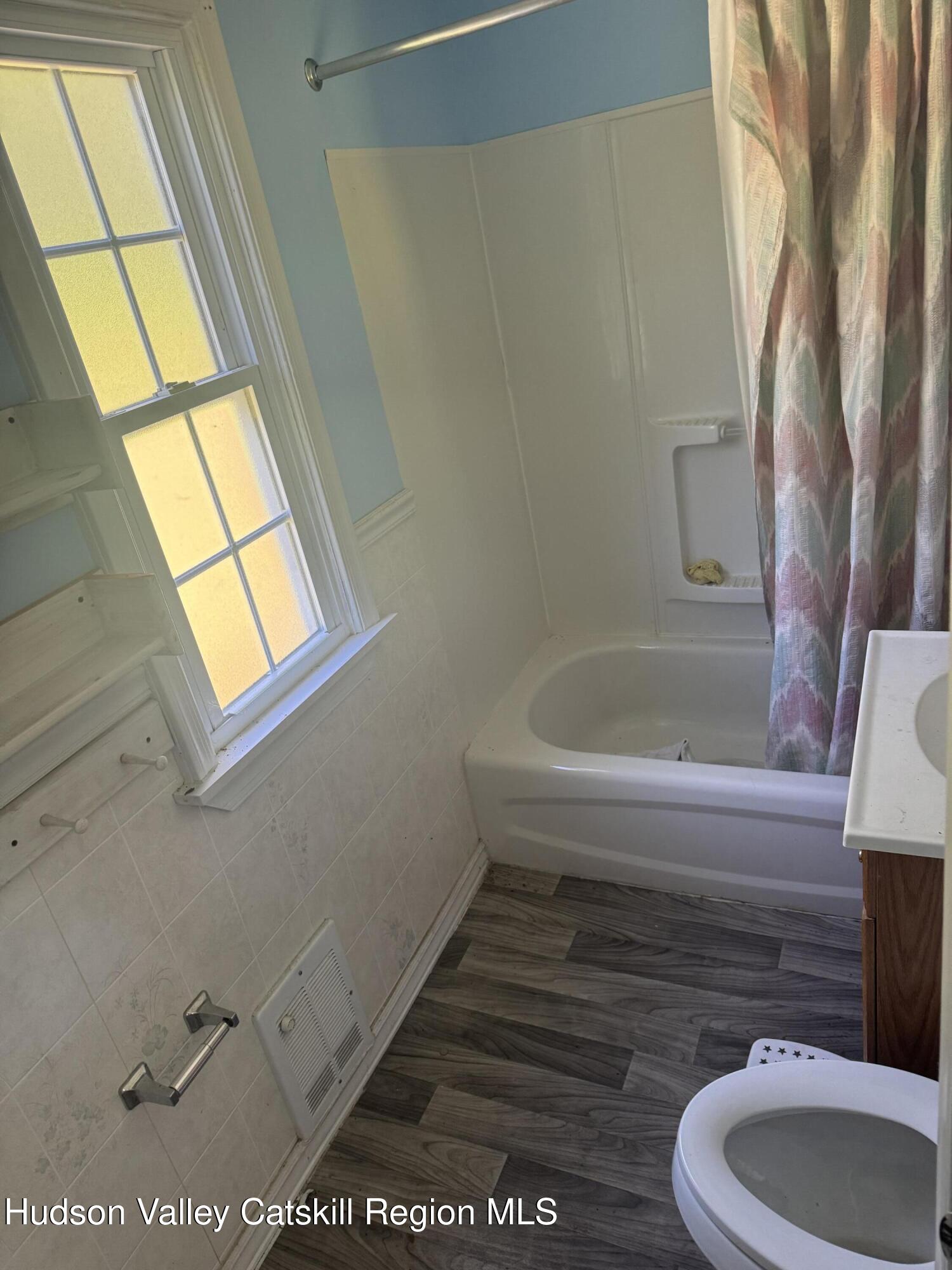 66-84 Katzman Road Ellenville, NY 12428 - Photo 29 of 30 a bathroom with a toilet and a bathtub