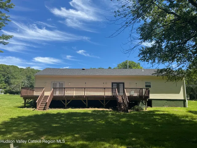a view of outdoor space with hardwood and lake view