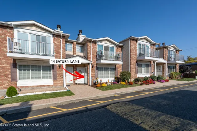 a front view of building with street