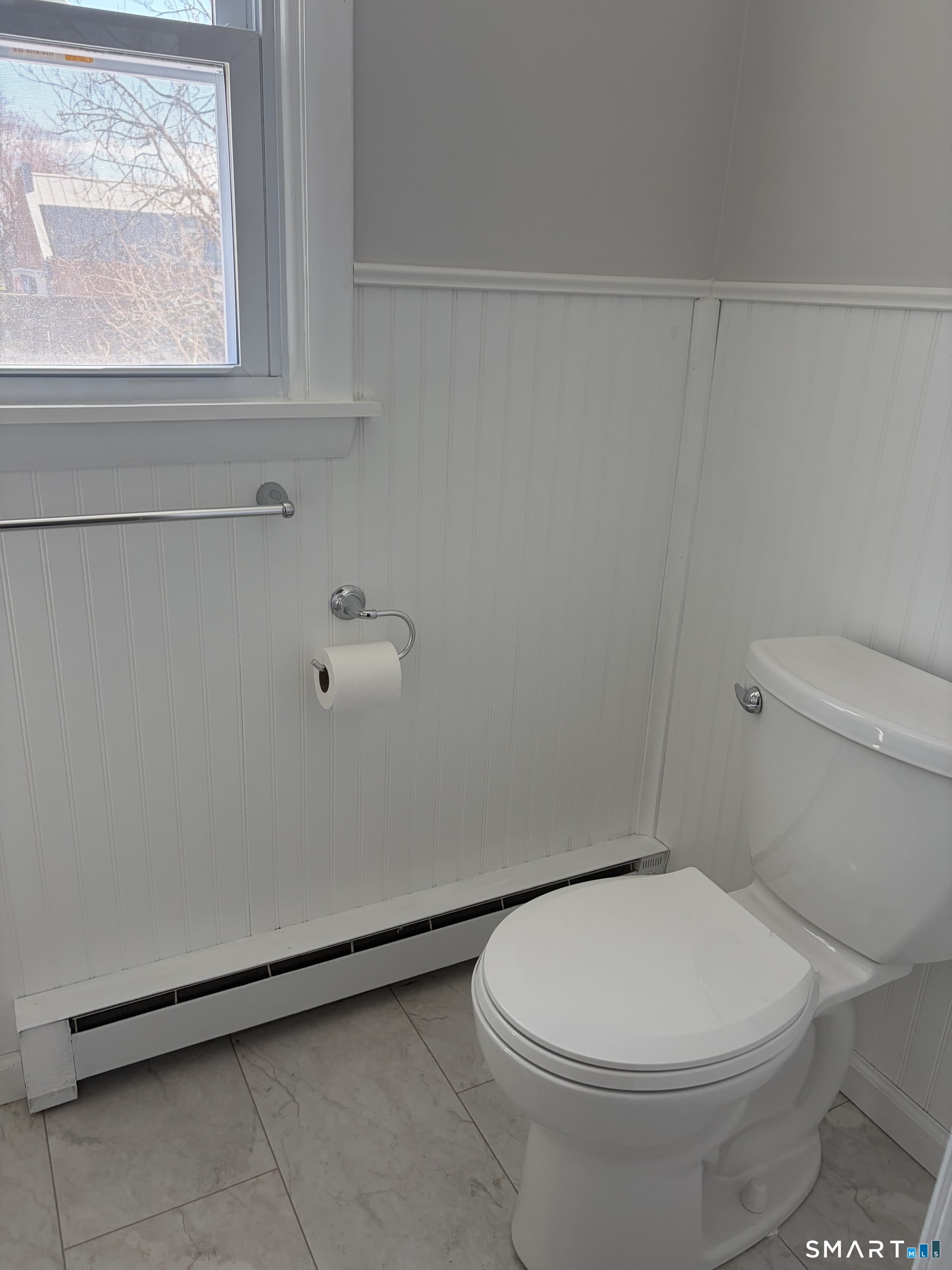 123 Longview Avenue Fairfield, CT 06824 - Photo 20 of 23 a white toilet sitting next to a window