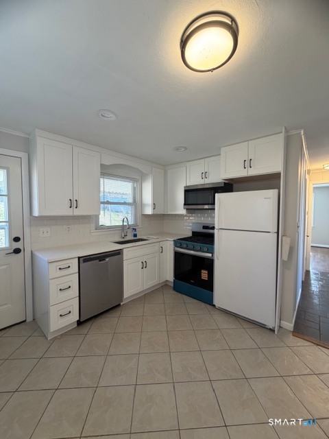 123 Longview Avenue Fairfield, CT 06824 - Photo 5 of 23 a kitchen with a cabinets and appliances