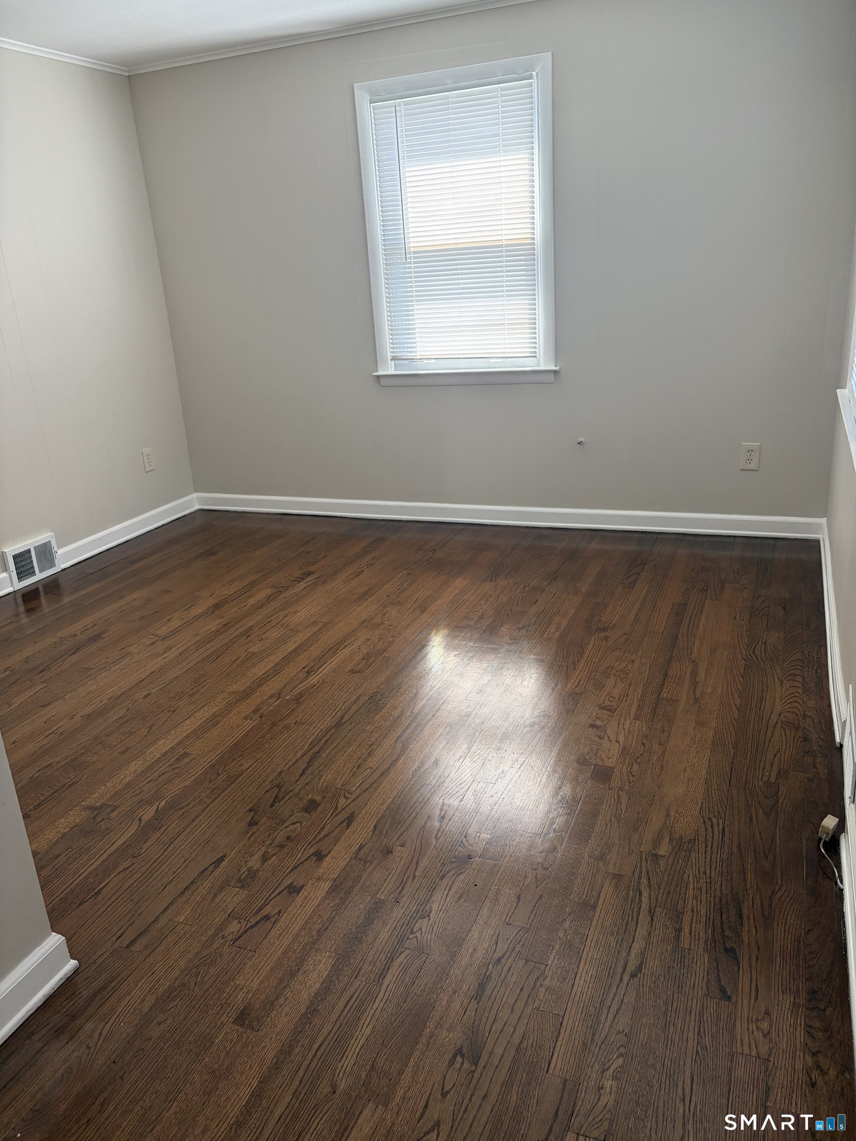 123 Longview Avenue Fairfield, CT 06824 - Photo 10 of 23 a view of a room with wooden floor and windows