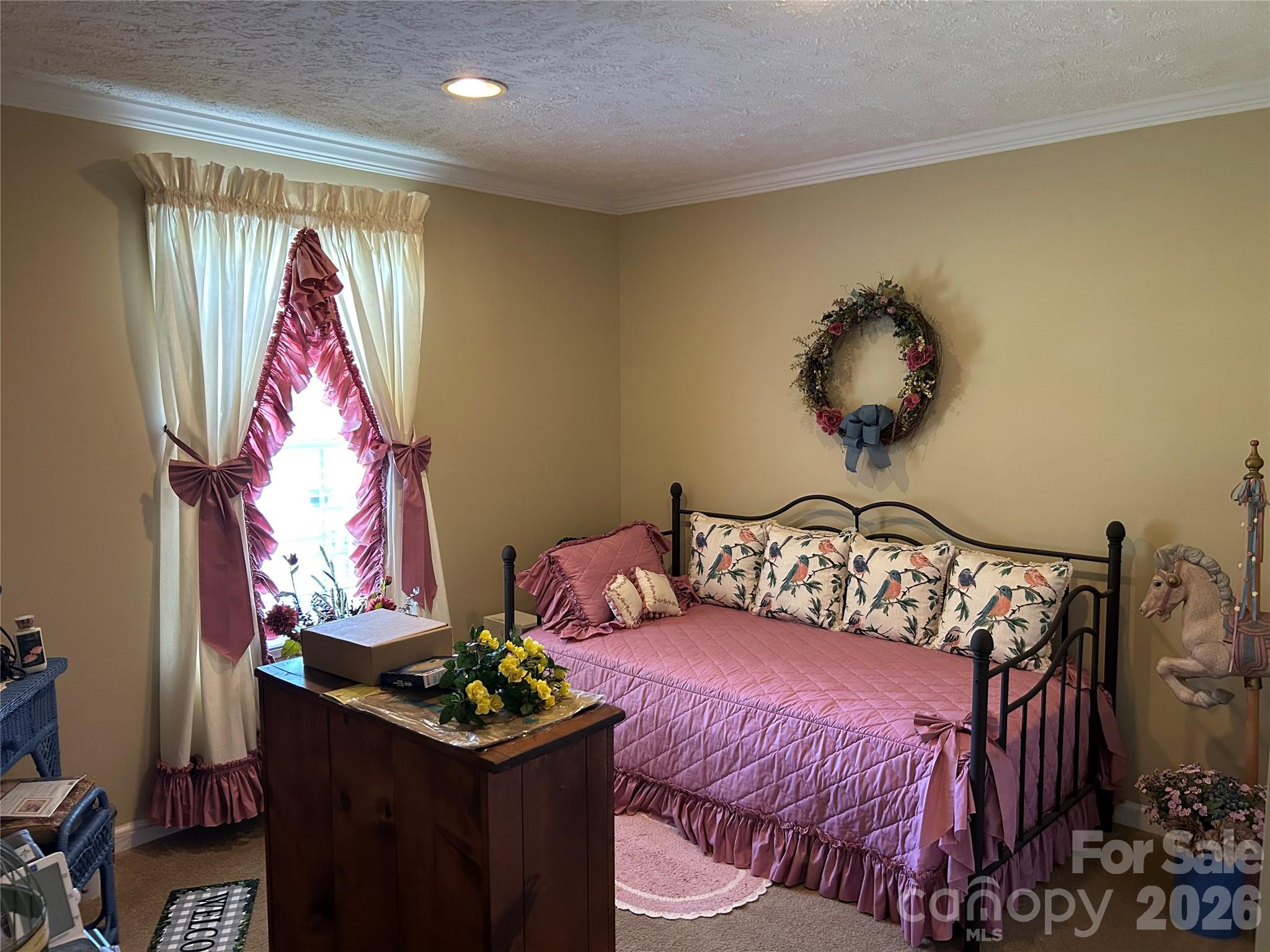 321 East Jones Street Blacksburg, SC 29702 - Photo 11 of 11 a bedroom with a bed and a chandelier