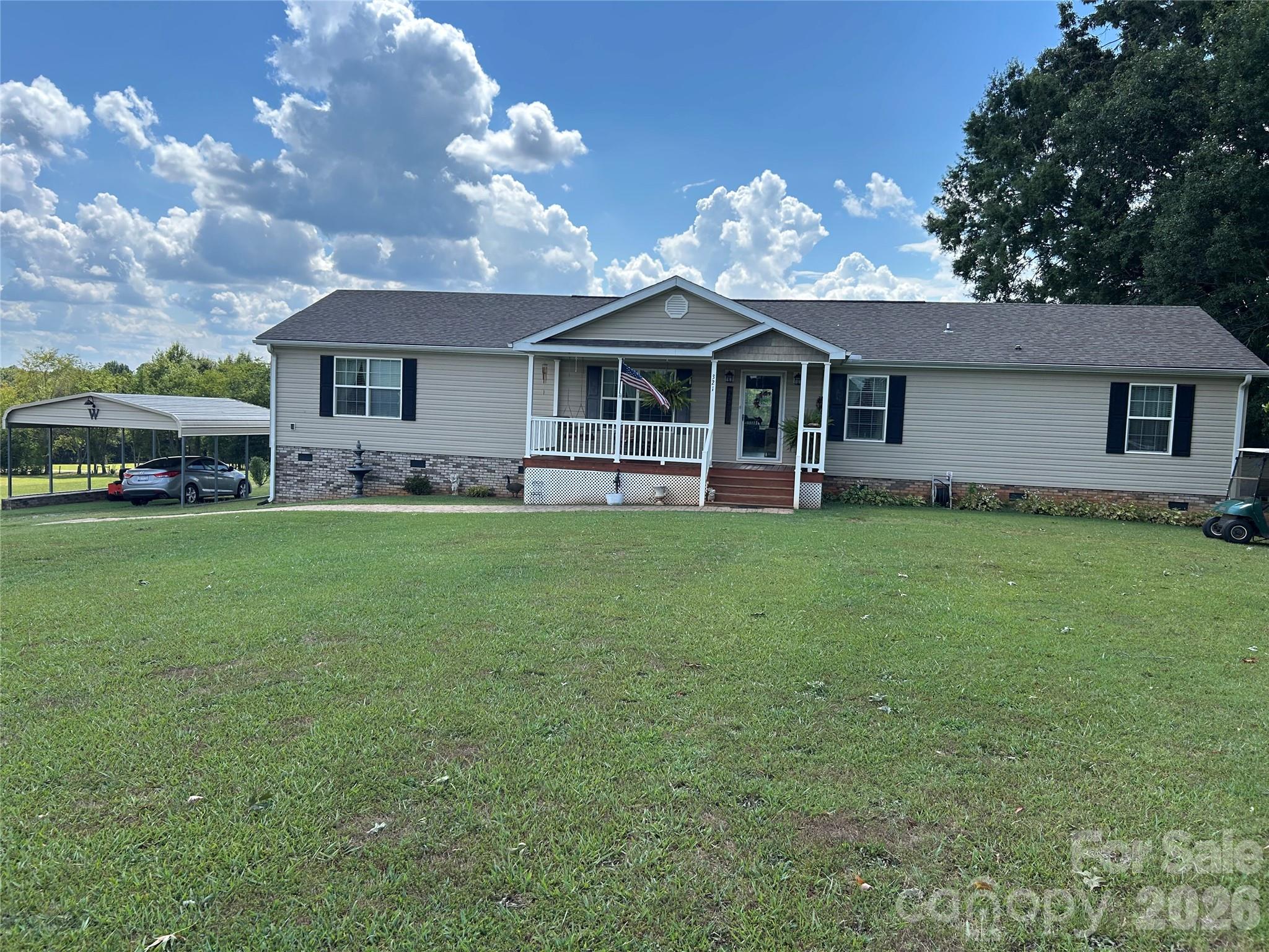 321 East Jones Street Blacksburg, SC 29702 - Photo 3 of 11 a view of a house with a yard and sitting area