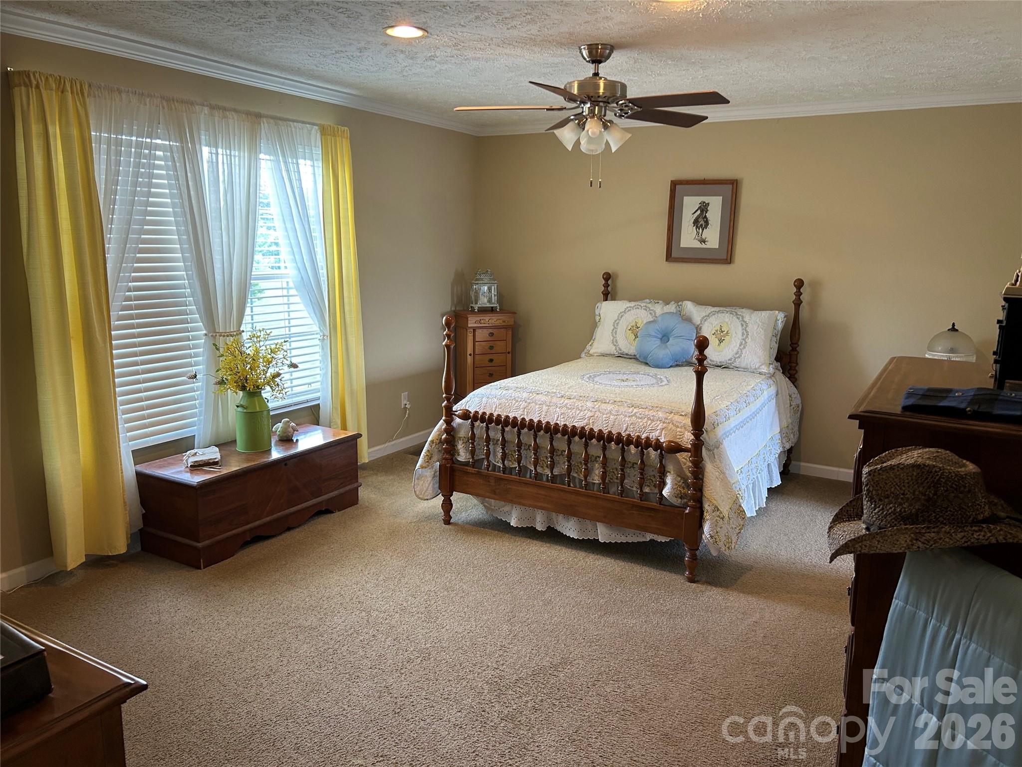 321 East Jones Street Blacksburg, SC 29702 - Photo 8 of 11 a bedroom with a bed a couch and a window