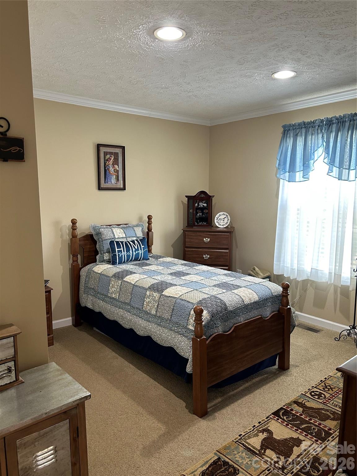 321 East Jones Street Blacksburg, SC 29702 - Photo 10 of 11 a bedroom with a bed and a window
