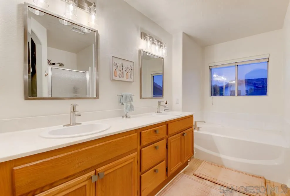 10205 Pinon Place Lakeside, CA 92040 - Photo 11 of 23 a bathroom with a tub sink and mirror