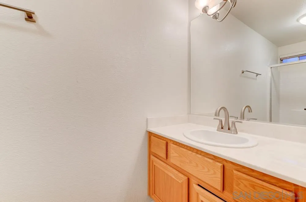 10205 Pinon Place Lakeside, CA 92040 - Photo 16 of 23 a bathroom with a sink and a mirror