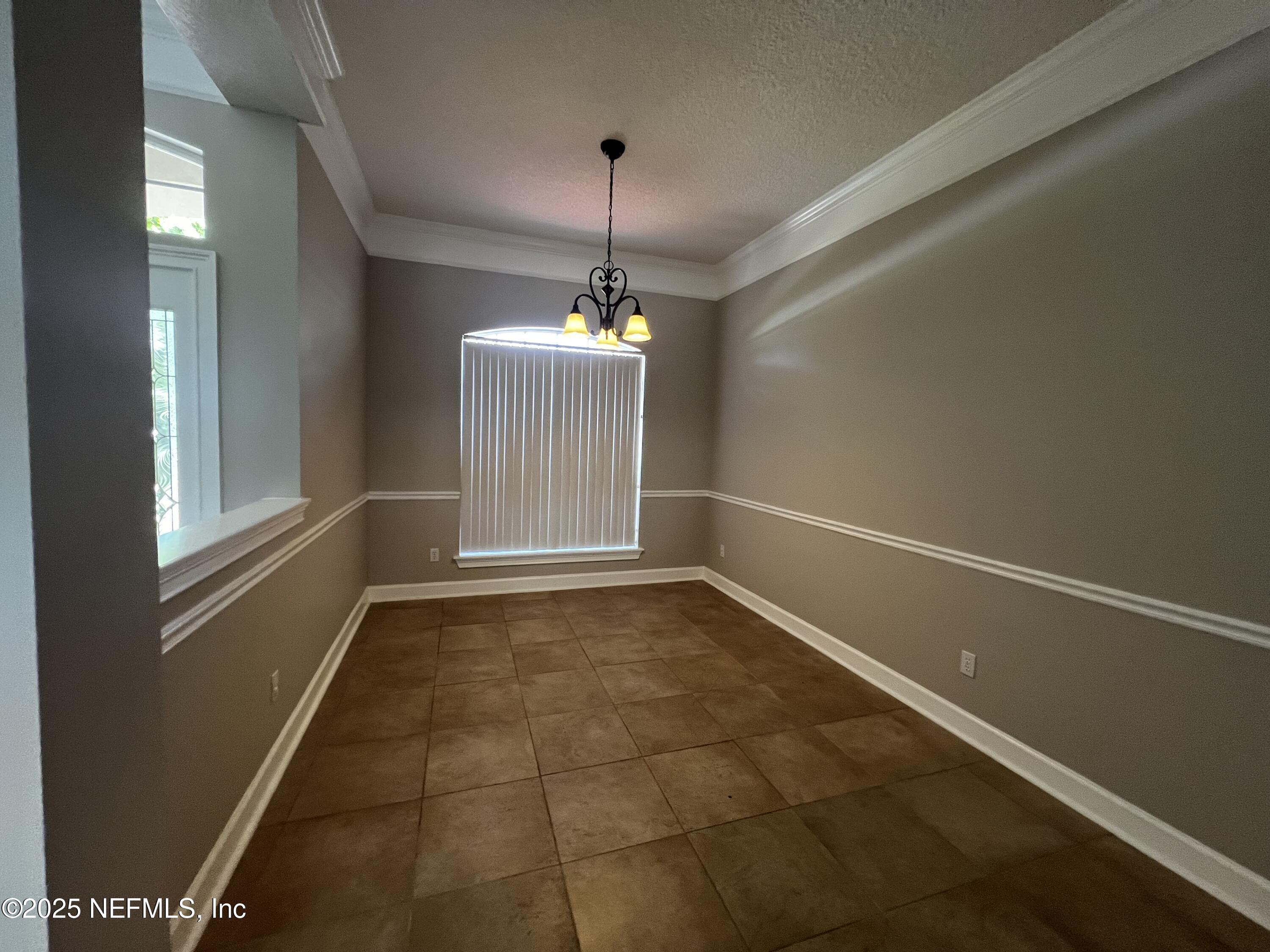 10310 Hamlet Glen Drive Jacksonville, FL 32221 - Photo 11 of 33 a view of an empty room with a window