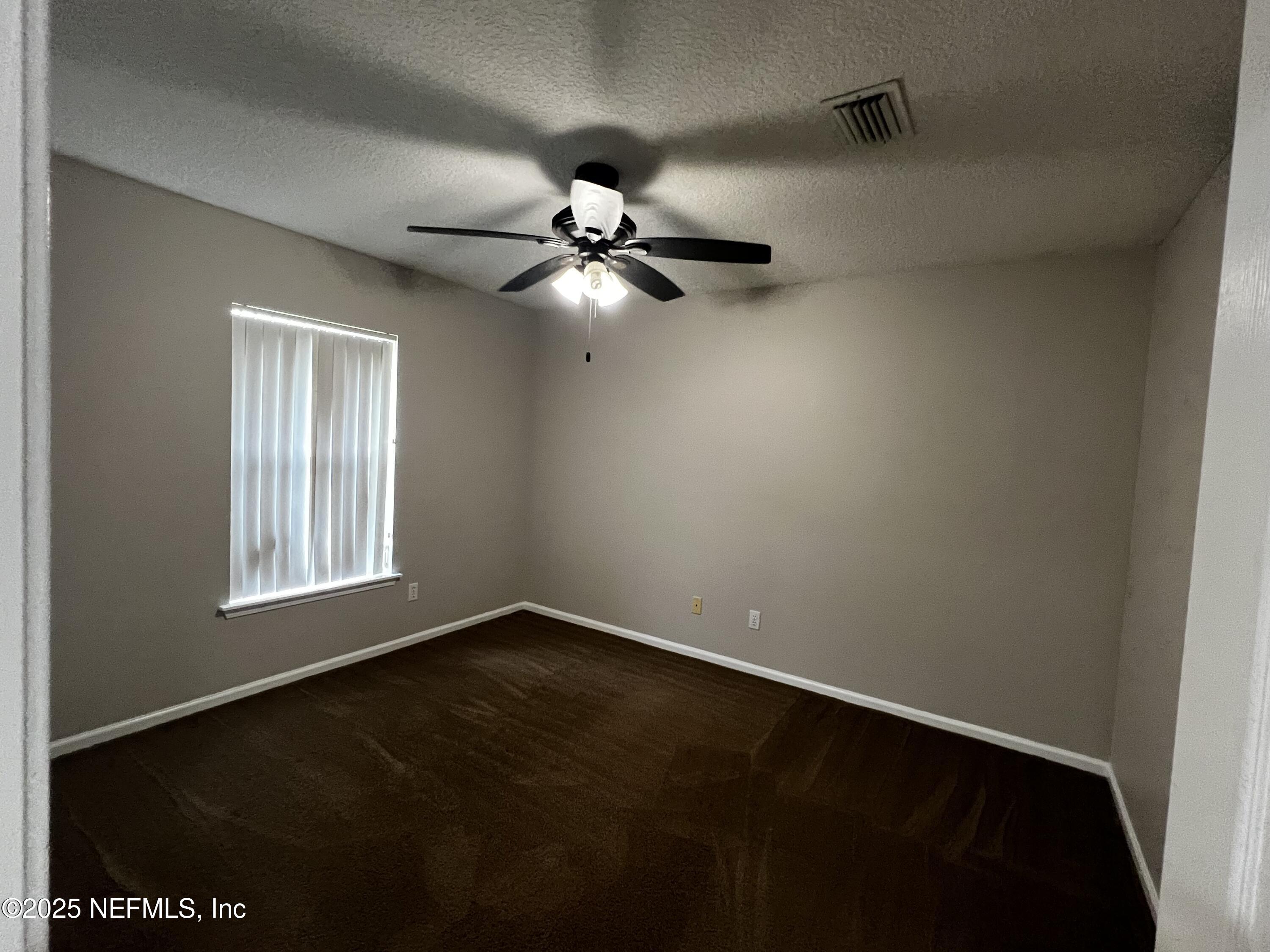 10310 Hamlet Glen Drive Jacksonville, FL 32221 - Photo 15 of 33 a view of an empty room with a window