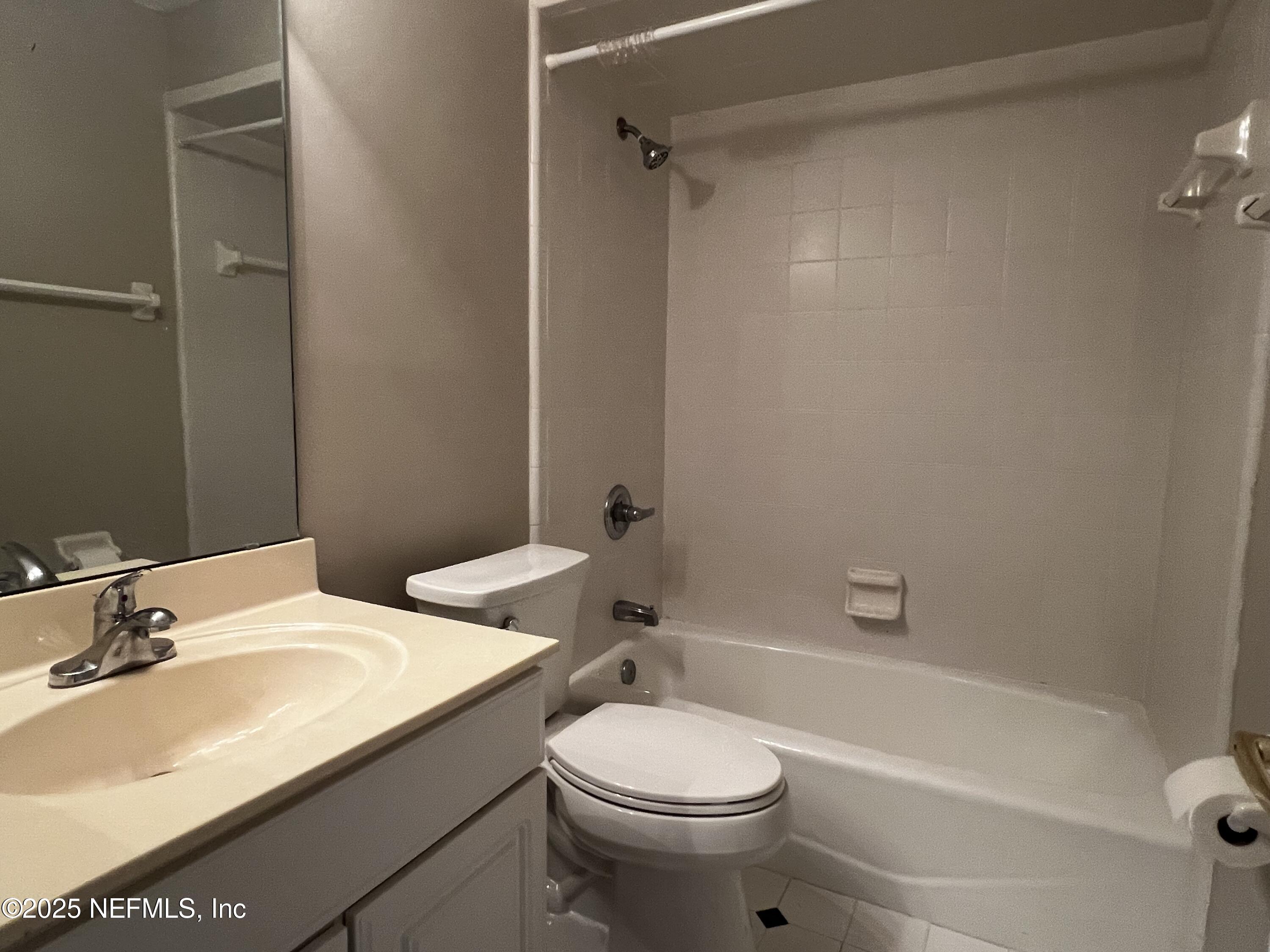 10310 Hamlet Glen Drive Jacksonville, FL 32221 - Photo 25 of 33 a bathroom with a sink toilet vanity and shower