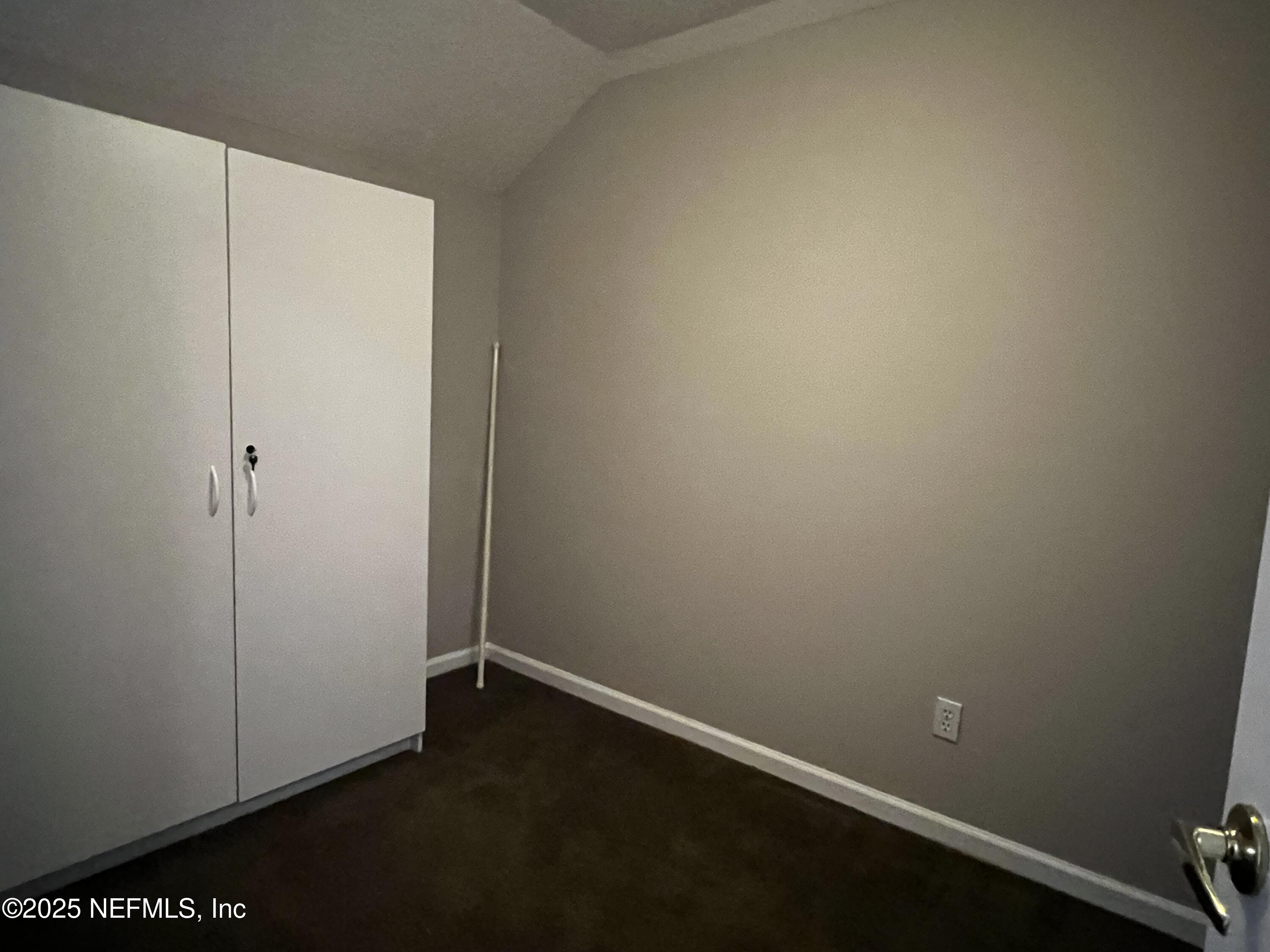 10310 Hamlet Glen Drive Jacksonville, FL 32221 - Photo 26 of 33 an empty room with closet