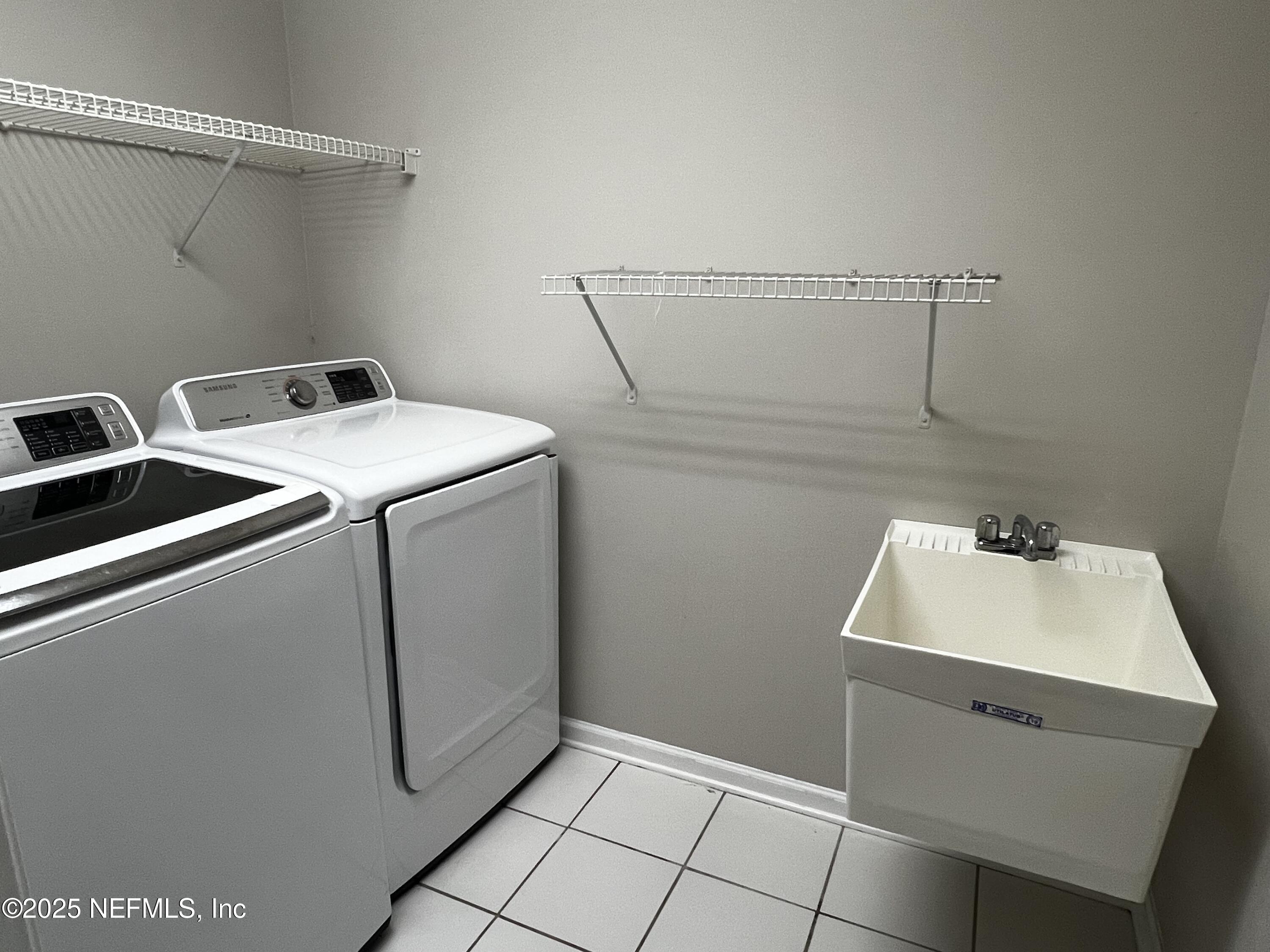 10310 Hamlet Glen Drive Jacksonville, FL 32221 - Photo 27 of 33 a utility room with dryer and washer