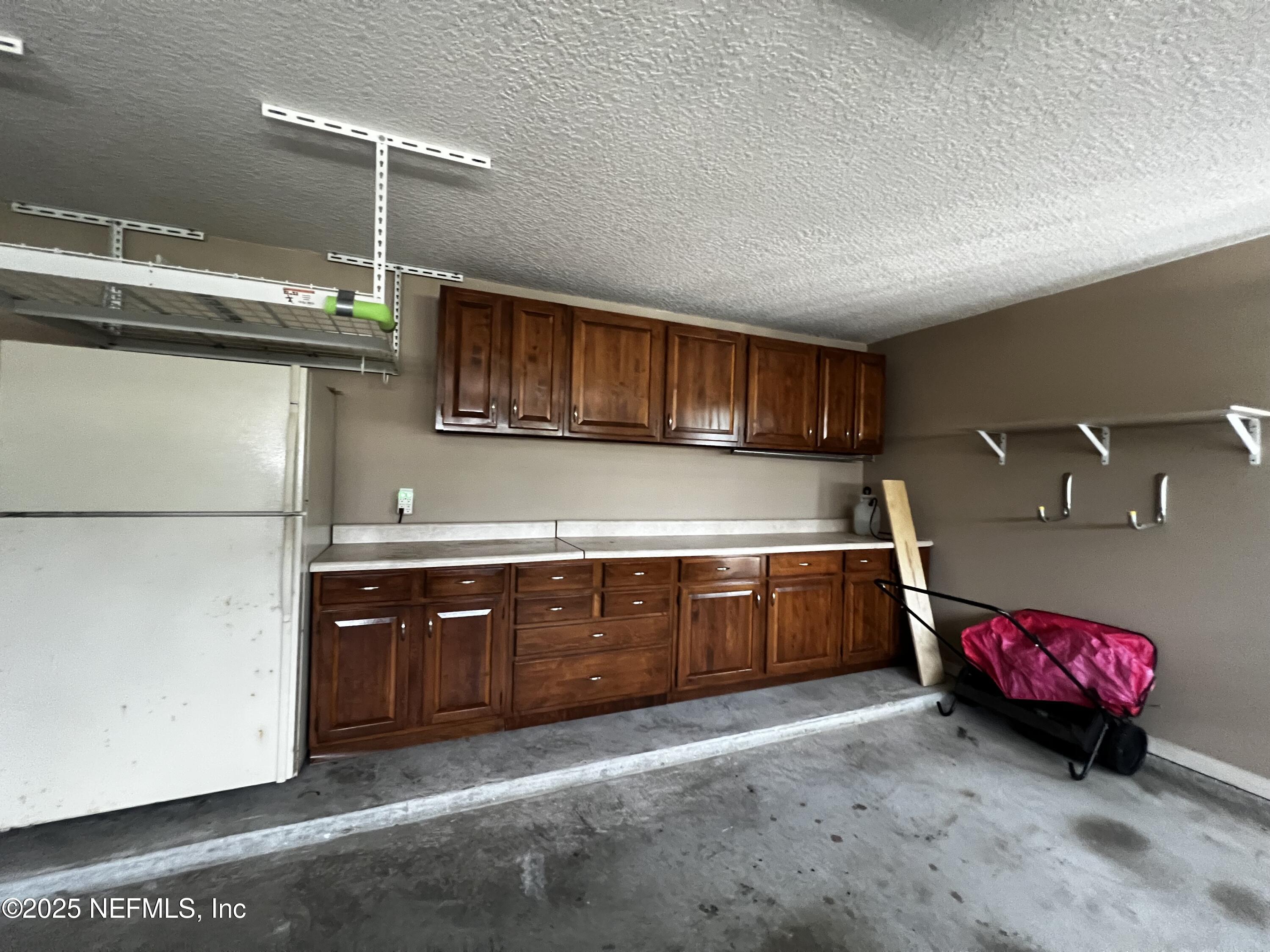 10310 Hamlet Glen Drive Jacksonville, FL 32221 - Photo 28 of 33 a kitchen with granite countertop a sink and a cabinets