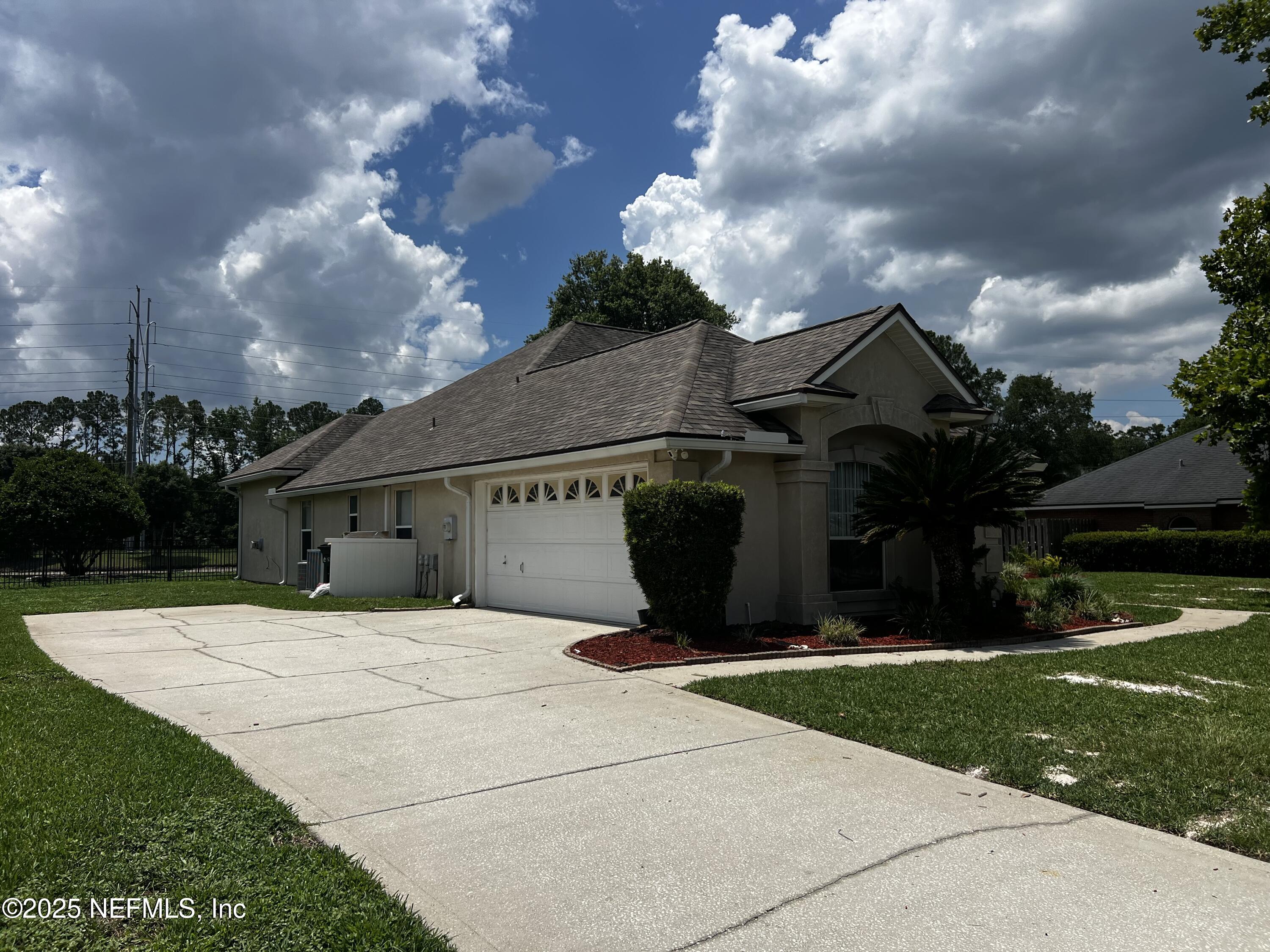 10310 Hamlet Glen Drive Jacksonville, FL 32221 - Photo 3 of 33 a view of house with yard and entertaining space