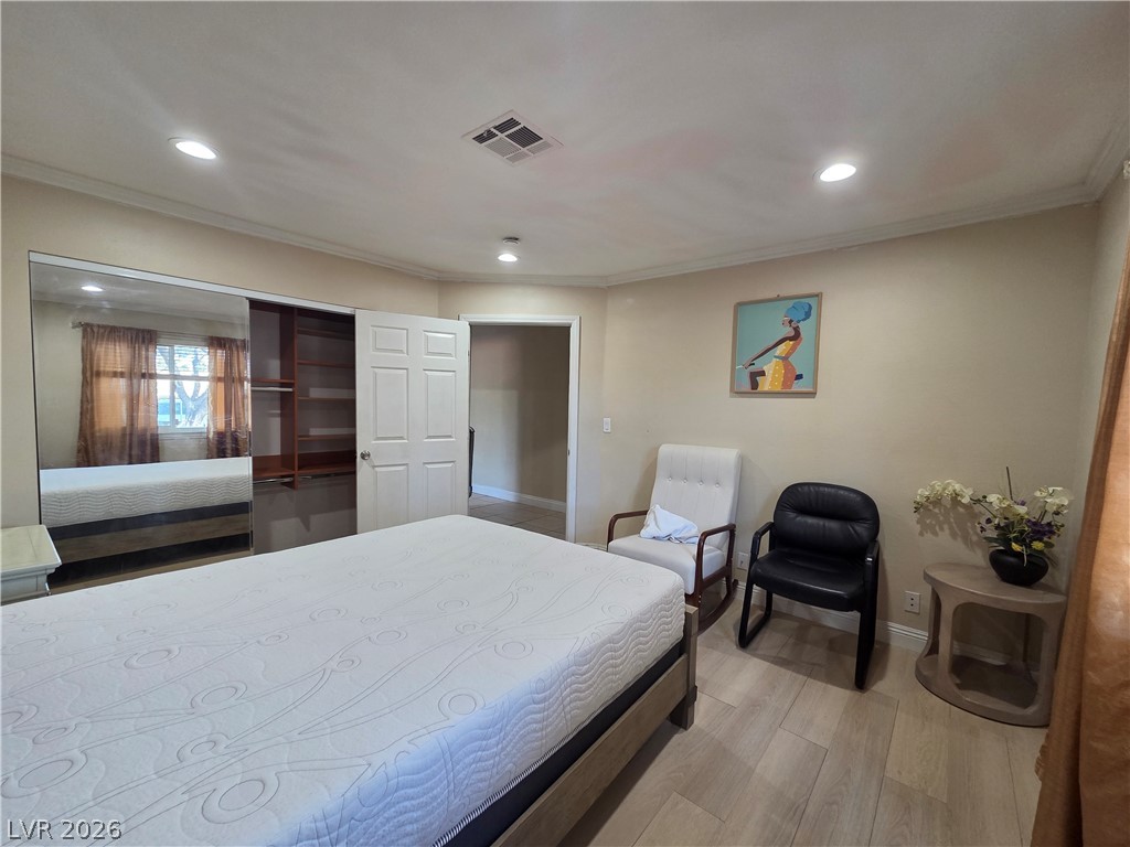 3381 Westwind Road Las Vegas, NV 89146 - Photo 50 of 52 Recessed lighting illuminates wood flooring, extending into a spacious walk-in closet.