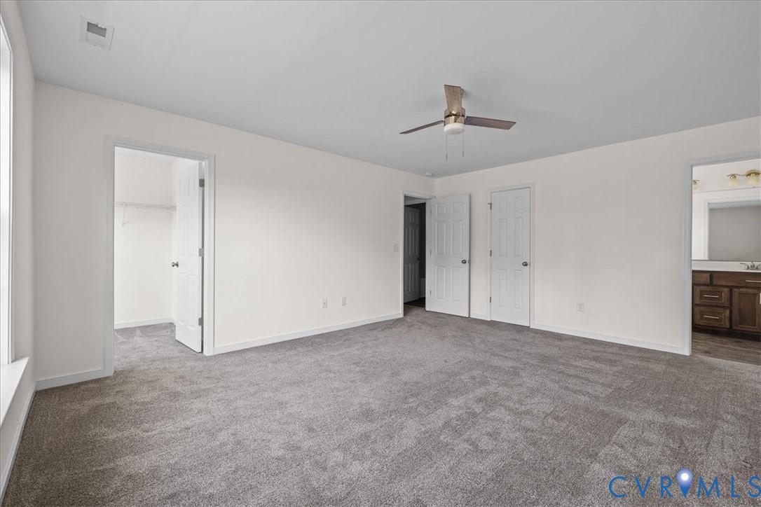 11325 Webb Road Disputanta, VA 23842 - Photo 17 of 32 a view of an empty room with a ceiling fan