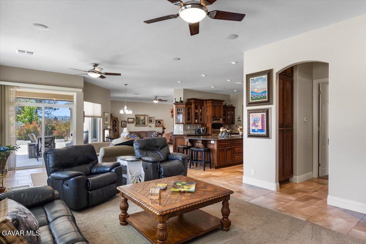 23840 Martingale Way Tehachapi, CA 93561 - Photo 22 of 63 a living room with furniture kitchen view and a chandelier