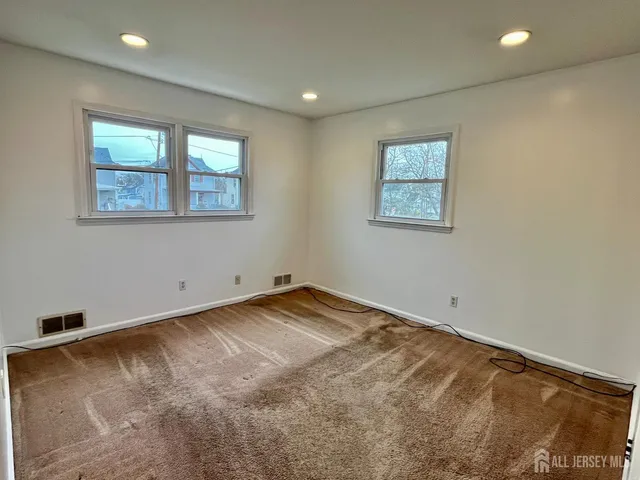 a view of entryway with wooden floor and stairs
