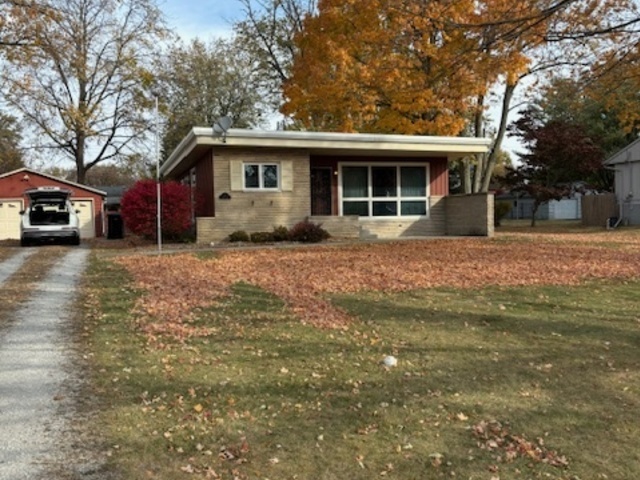 12 Linda Lane Normal, IL 61761 - Photo 2 of 3 a front view of a house with a yard and garage