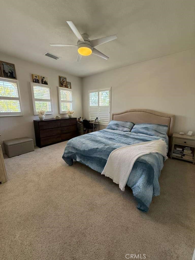 2931 Esperanza Way, Unit B Simi Valley, CA 93063 - Photo 37 of 49 a bed sitting in a bedroom next to a window