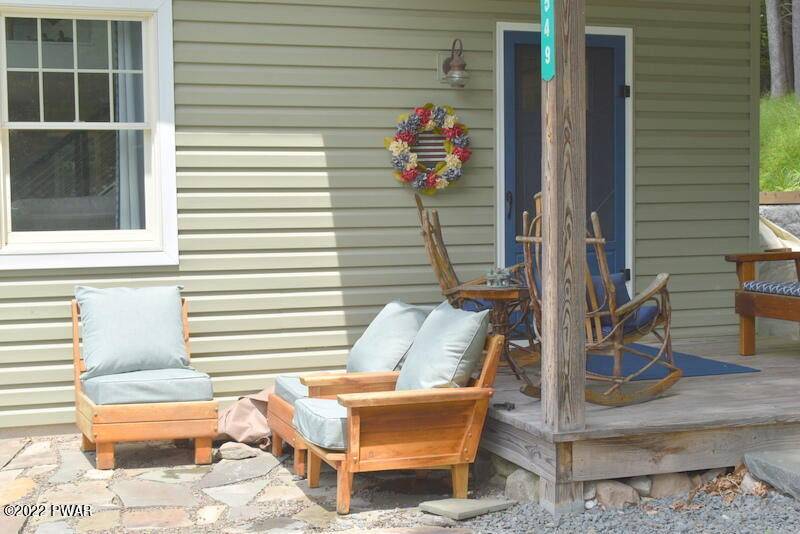 549 Finn Swamp Road Lakeville, PA 18438 - Photo 26 of 35 a front view of a house with outdoor seating