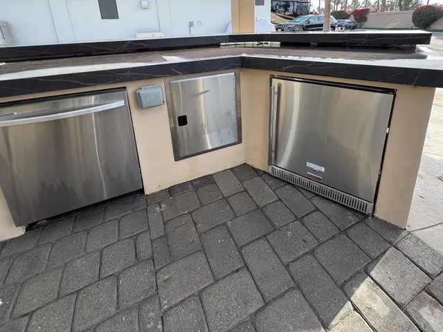 a kitchen with a sink and cabinets