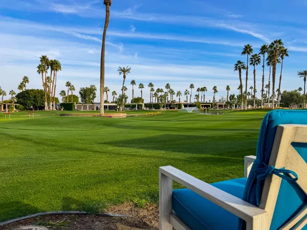 a view of a golf course with a lake view