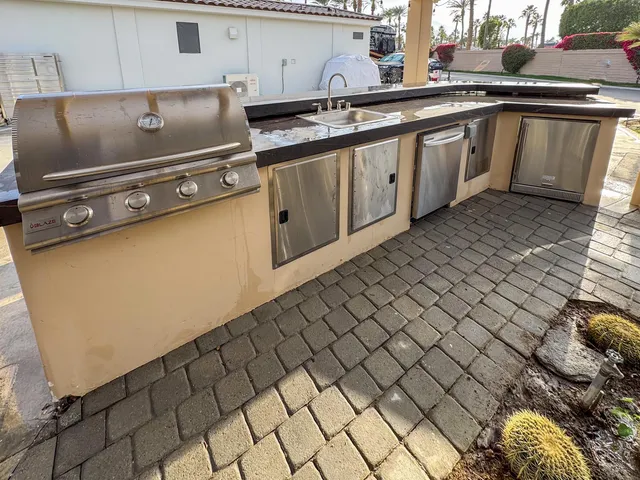 a kitchen with a sink and cabinets