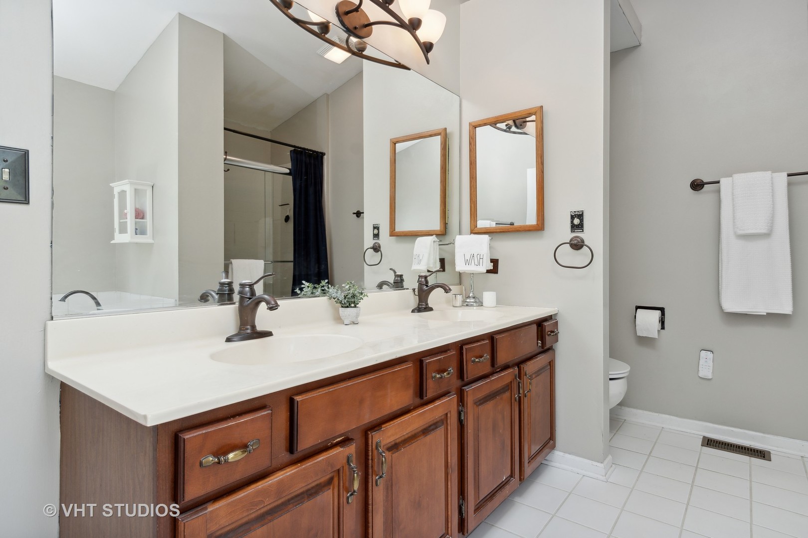 2780 Carriage Way Aurora, IL 60504 - Photo 11 of 19 a bathroom with a sink double vanity and a mirror