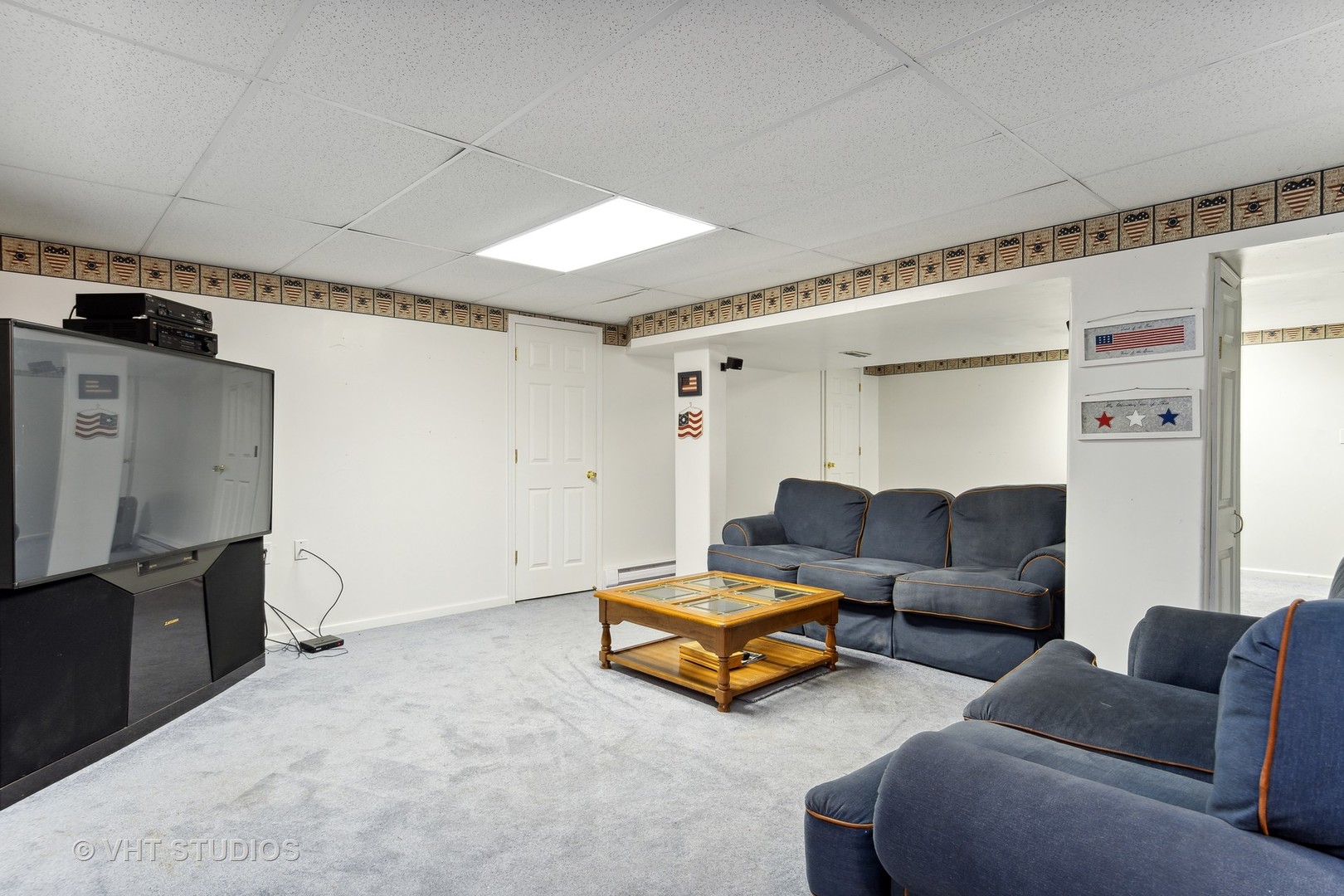 2780 Carriage Way Aurora, IL 60504 - Photo 16 of 19 a living room with furniture and a flat screen tv
