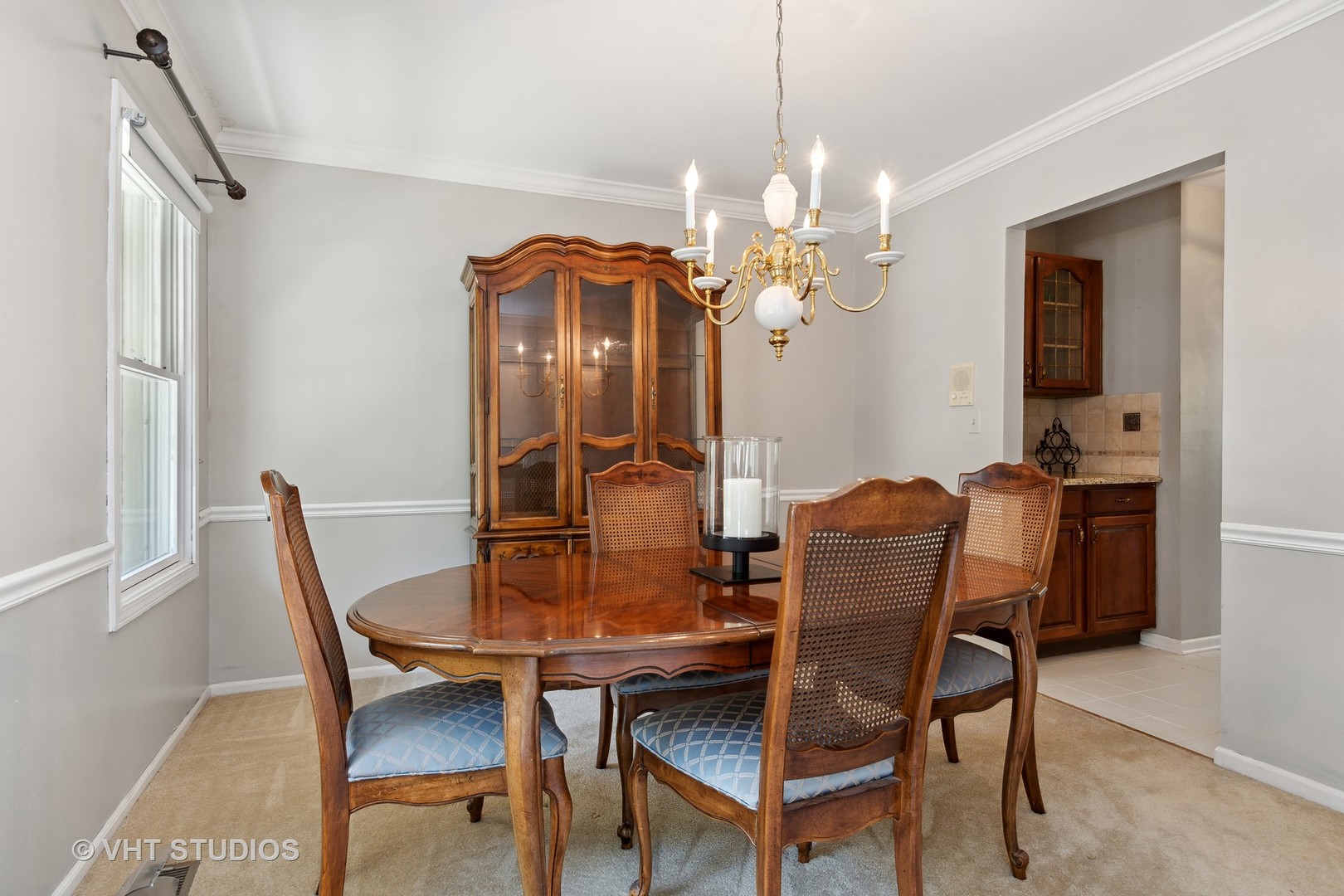 2780 Carriage Way Aurora, IL 60504 - Photo 7 of 19 a view of a dining room with furniture and chandelier