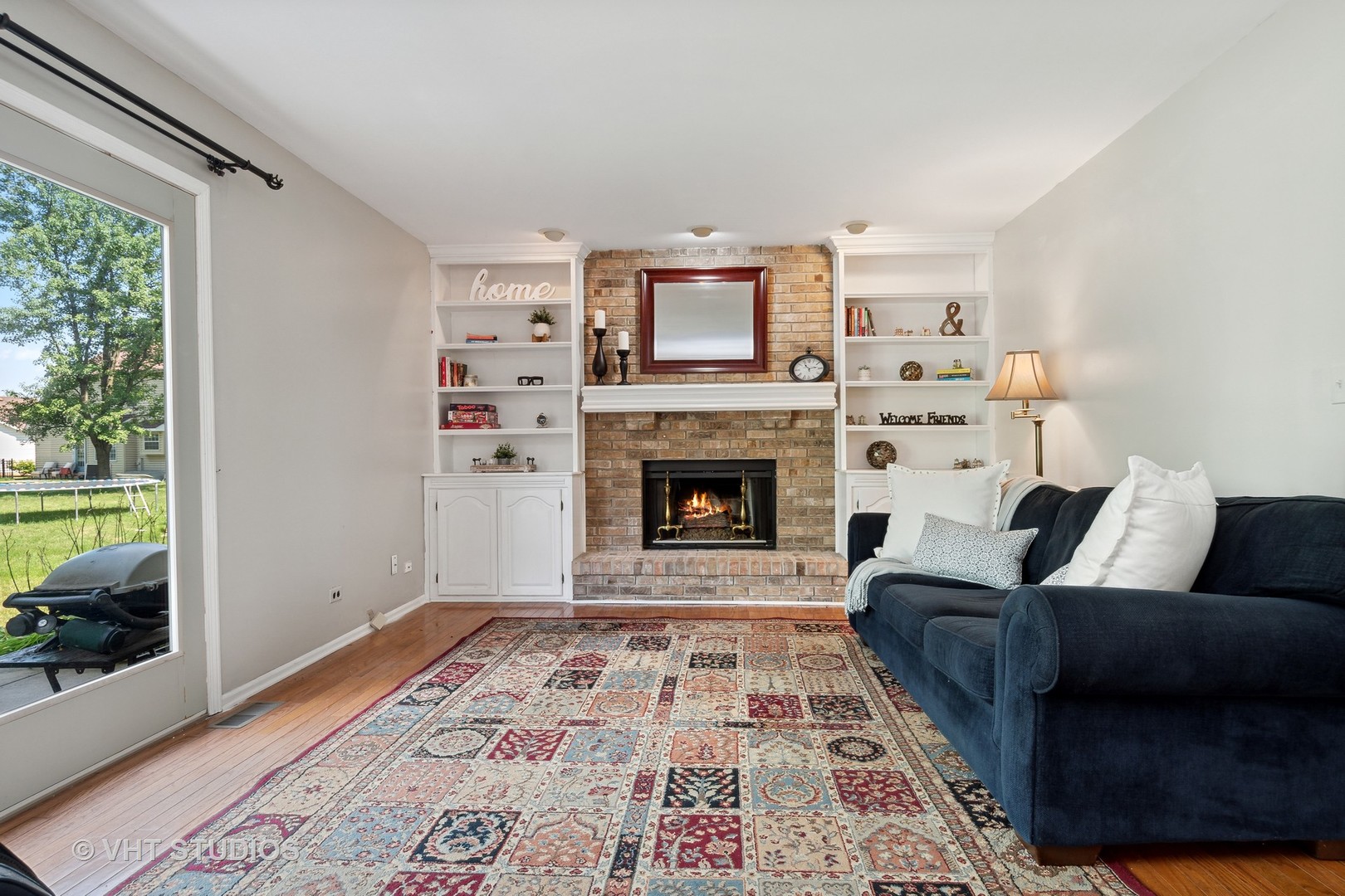 2780 Carriage Way Aurora, IL 60504 - Photo 8 of 19 a living room with furniture and a fireplace