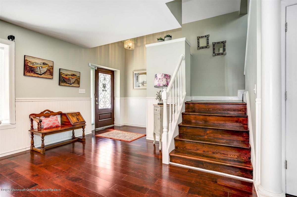 2510 Scott Road Wall, NJ 07719 - Photo 3 of 35 a view of a hallway with wooden floor and furniture