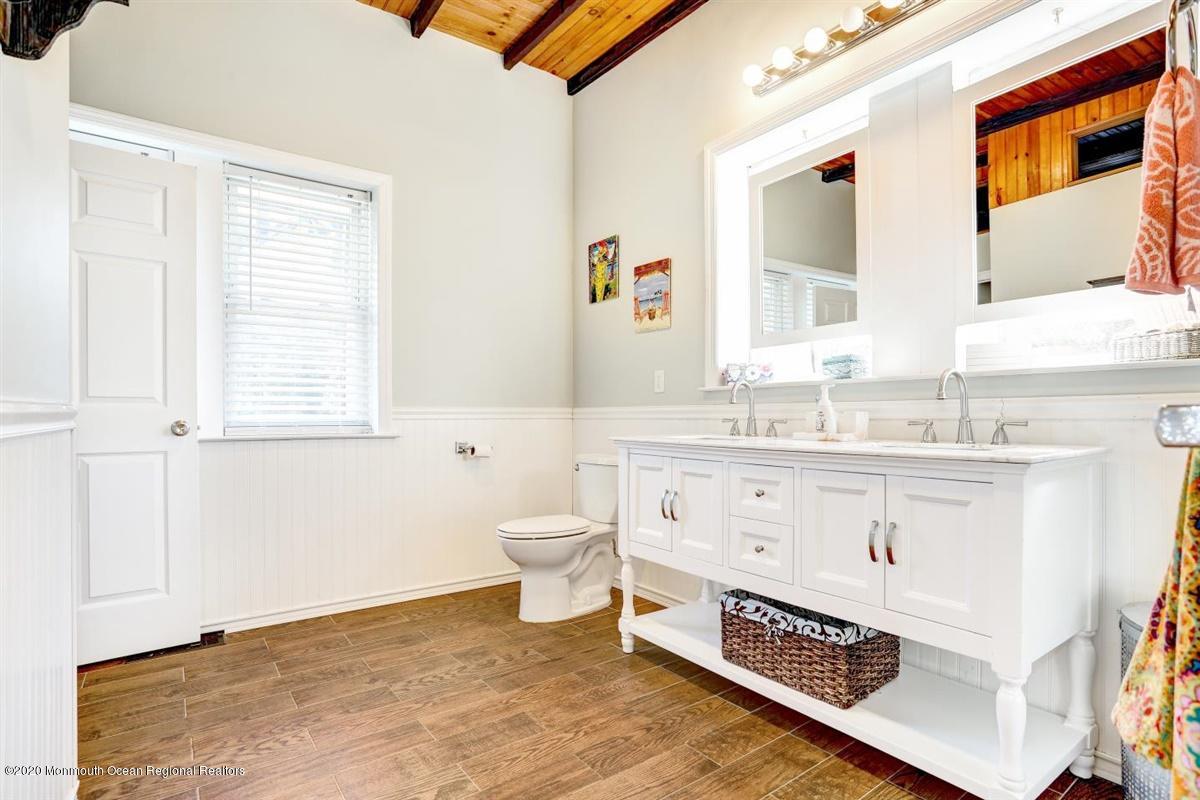 2510 Scott Road Wall, NJ 07719 - Photo 22 of 35 a bathroom with a sink double vanity and a toilet