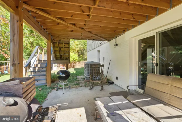 a view of a yard with large trees