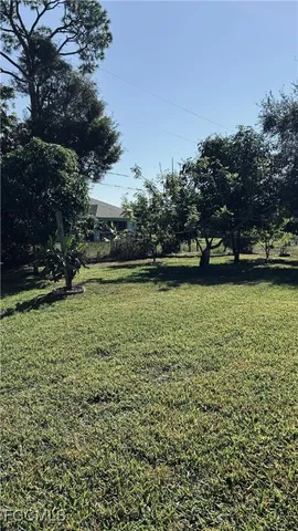 a view of a water fountain and a bench