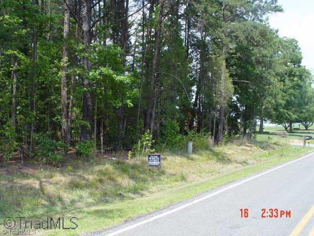 7147 Ludgate Road Gibsonville, NC 27249 - Photo 1 of 7 Exterior Front. Lot 24 Glen Oaks. Large-2+ Ac wooded lot. Lays nearly flat. A must see property.