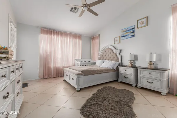 a bedroom with a bed and a dresser