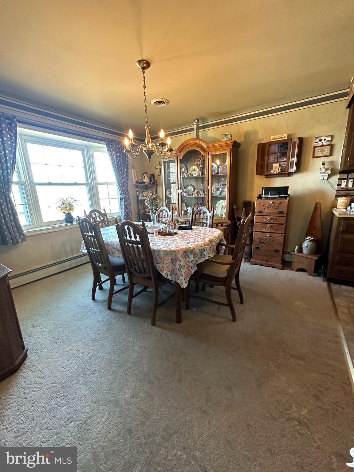 3203 Mannerchor Road Temple, PA 19560 - Photo 5 of 15 a dining room with furniture and chandelier