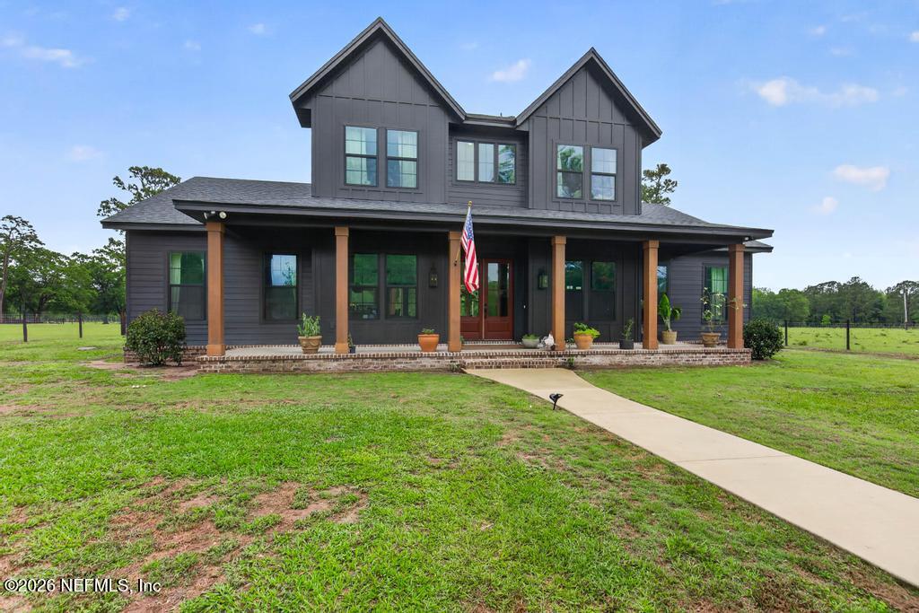 2955 Carroll Corner Road Hilliard, FL 32046 - Photo 4 of 106 a view of a house with yard and front view of a house