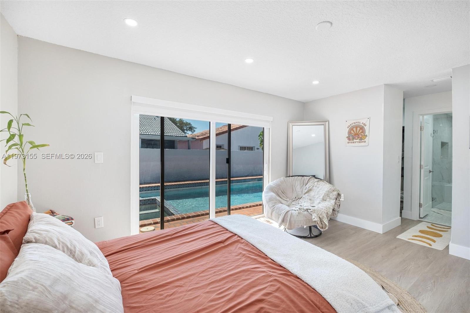13710 Southwest 18th Terrace Miami, FL 33175 - Photo 14 of 46 a bedroom with a bed and a large mirror