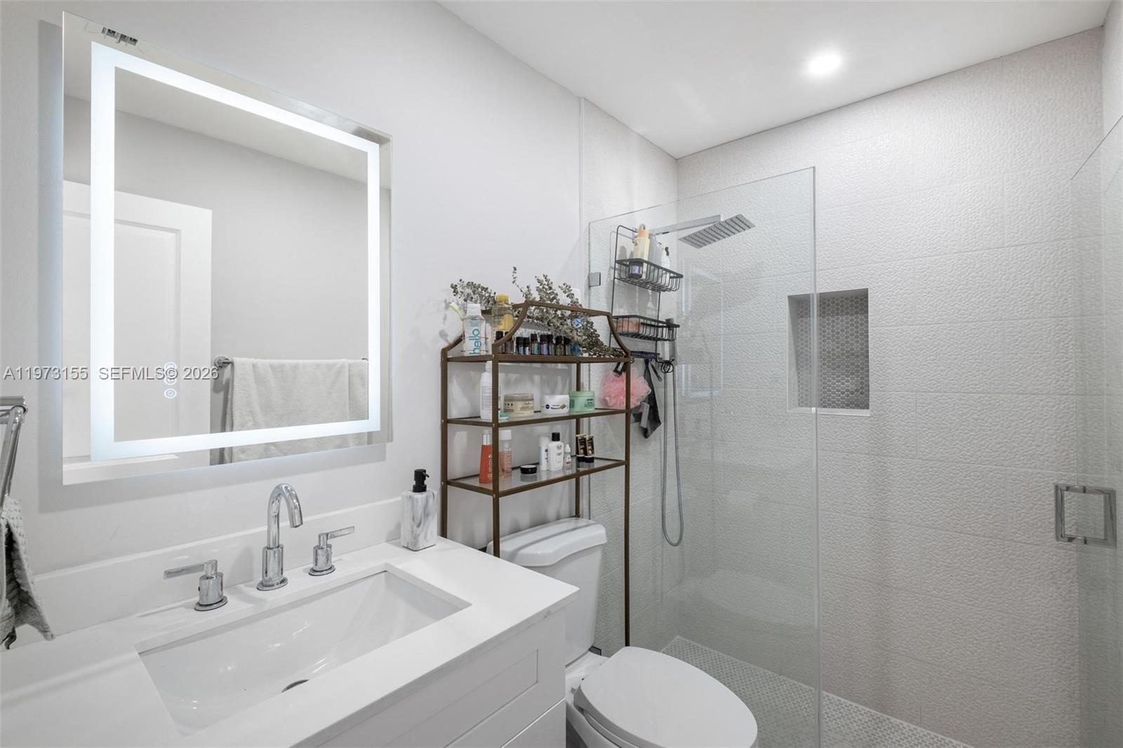 13710 Southwest 18th Terrace Miami, FL 33175 - Photo 18 of 46 a bathroom with a sink toilet and shower