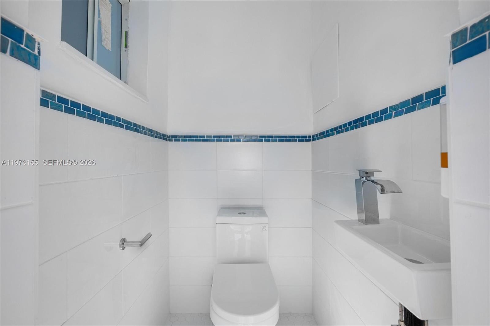 13710 Southwest 18th Terrace Miami, FL 33175 - Photo 20 of 46 a bathroom with a shower a sink and toilet