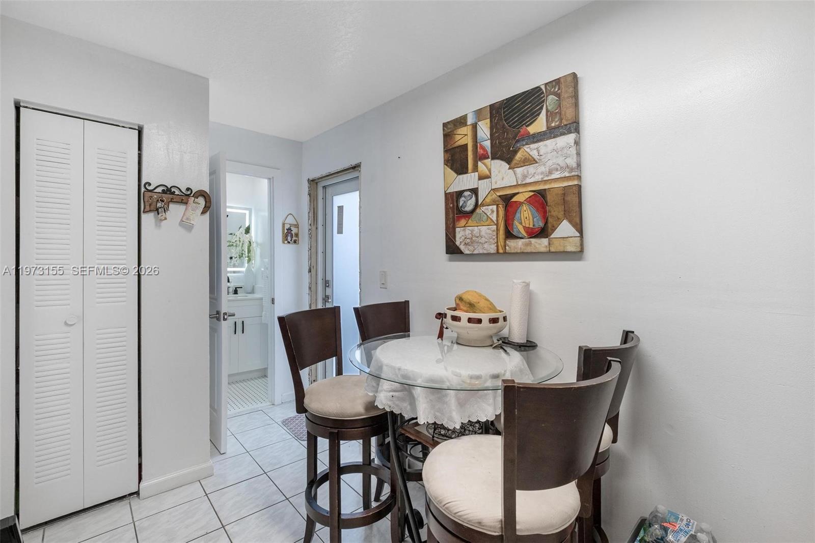 13710 Southwest 18th Terrace Miami, FL 33175 - Photo 24 of 46 a view of a dining room with furniture window and wooden floor