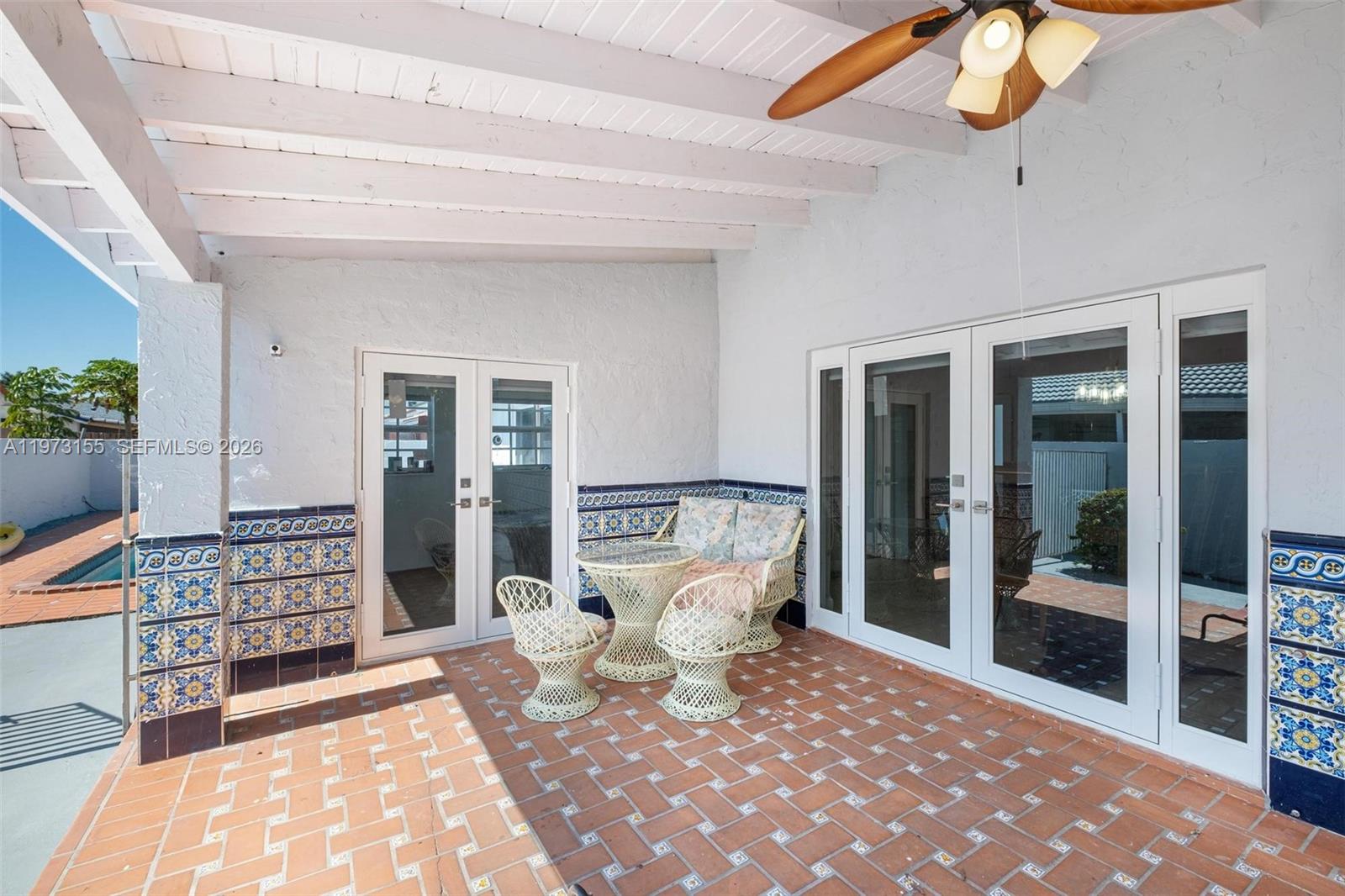 13710 Southwest 18th Terrace Miami, FL 33175 - Photo 30 of 46 a large bedroom with a large bed and a chandelier