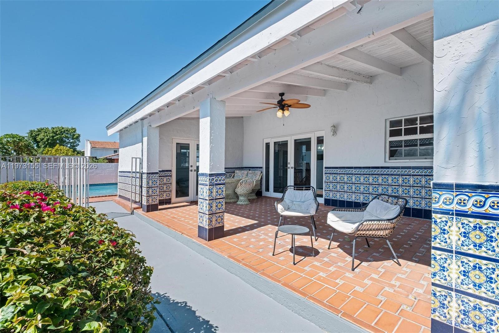 13710 Southwest 18th Terrace Miami, FL 33175 - Photo 32 of 46 a view of a patio with couches table and chairs and potted plants