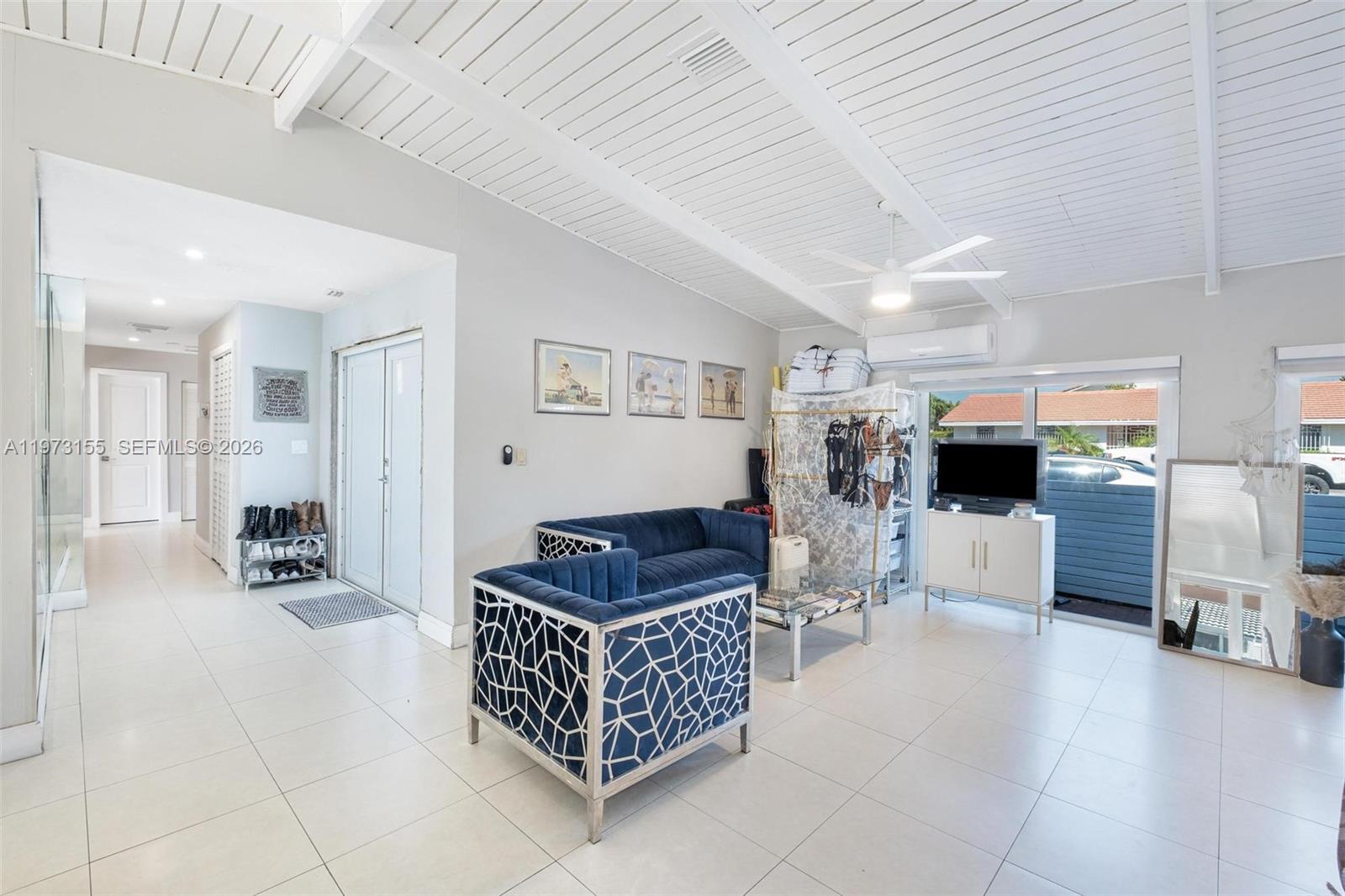 13710 Southwest 18th Terrace Miami, FL 33175 - Photo 5 of 46 a room with lots of furniture and gym equipment