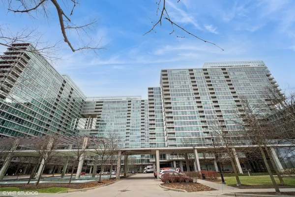 a view of a room with wooden floor and windows